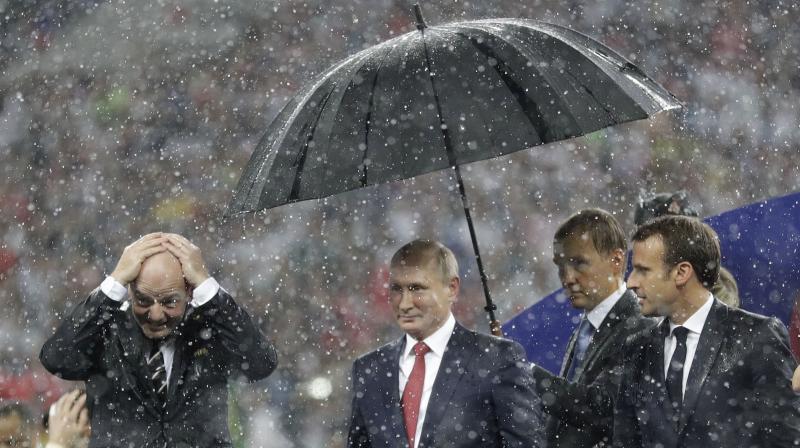 A fierce downpour followed as both the teams were presented with the medals. (Photo: AP)