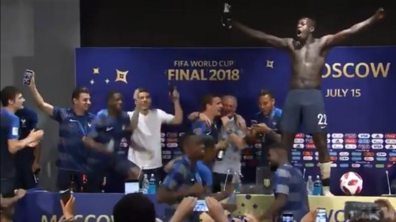 Paul Pogba and Benjamin Mendy led the charge, drenching their boss in champagne and a few other journalists present.(Photo: Screengrab)