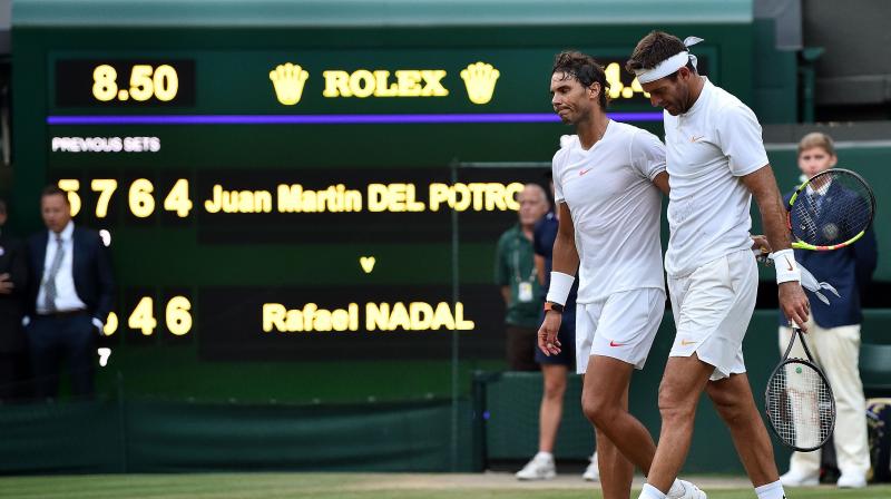 After 4 hours, 48 minutes of gruelling encounter, Rafael Nadal, who won the match, went over to give del Potro a lengthy hug. Then they walked to the sideline together, arms draped across each others shoulders. (Photo: AFP)