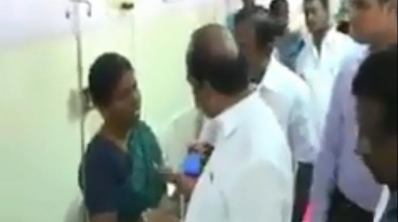 Pointing to the wound on her sons head, the woman asked Minister Kadambur Raju  what he would have done if his son had sustained such an injury. (Photo: Screengrab)