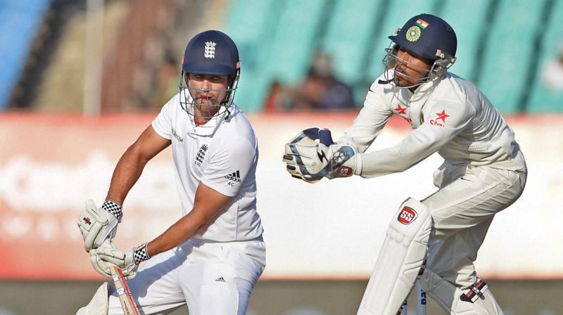 England batsman Alastair Cook plays a shot on the fourth day of the first test cricket match against India in Rajkot on Saturday (Photo: AP)