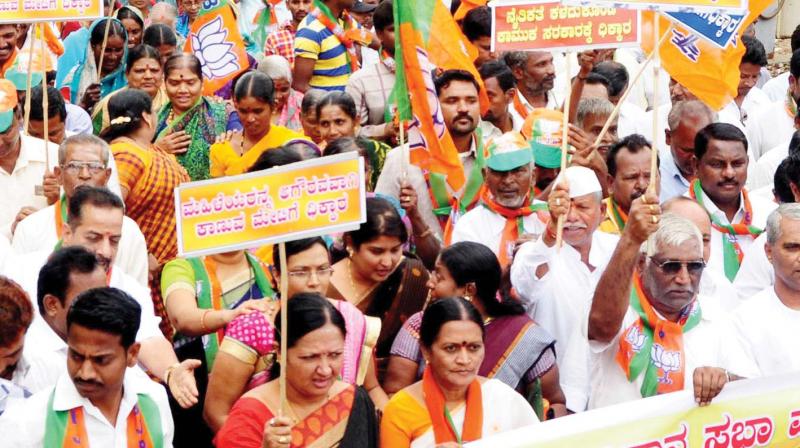 BJP workers take out a rally against Excise Minister H.Y. Meti in Bagalkote on Wednesday.