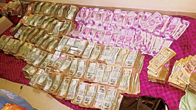 The currency that was seized from a apartment in Yeshwantpur in Bengaluru on Wednesday (Photo: DC)