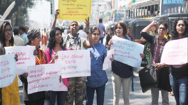 Women trekkers affiliated to various womens groups protest accusing government in disallowing them into Agasthyakoodam in Thiruvananthapuram on Saturday. (Photo:  DC)