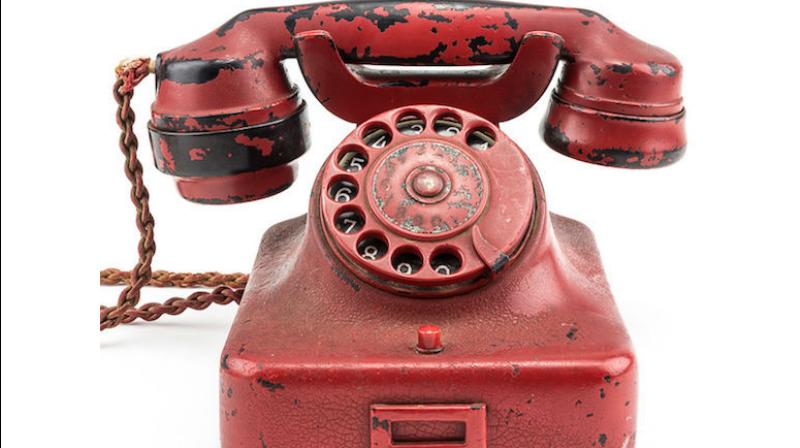 Originally a black Bakelite phone, later painted crimson and engraved with Hitlers name, the relic was found in the Nazi leaders Berlin bunker in 1945 following the regimes defeat. Photo Credit: Alexander Historical Auctions