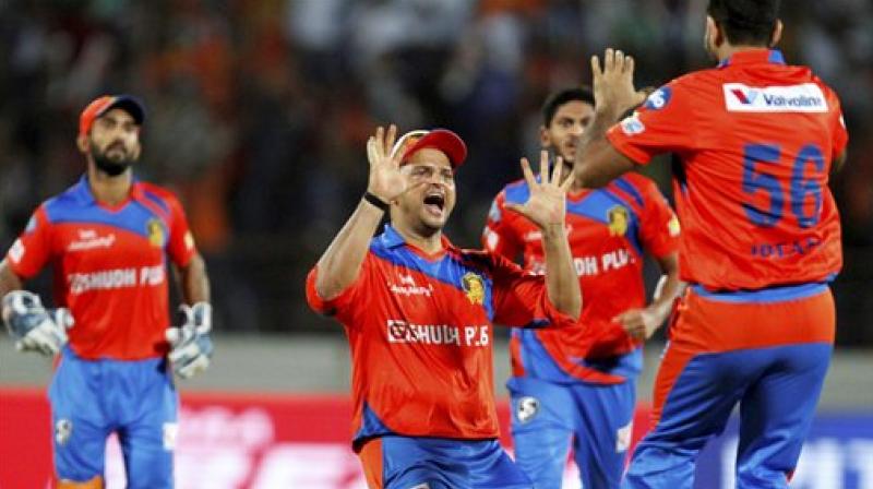 Gujarat Lions bowler celebrates the wicket of Mumbai Indians batsman Mitchell McClenaghan during the IPL T20 match played in Rajkot (Photo: PTI)