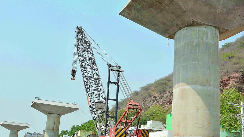 Kanakadurga flyover works in progress at One Town in Vijayawada on Thursday.