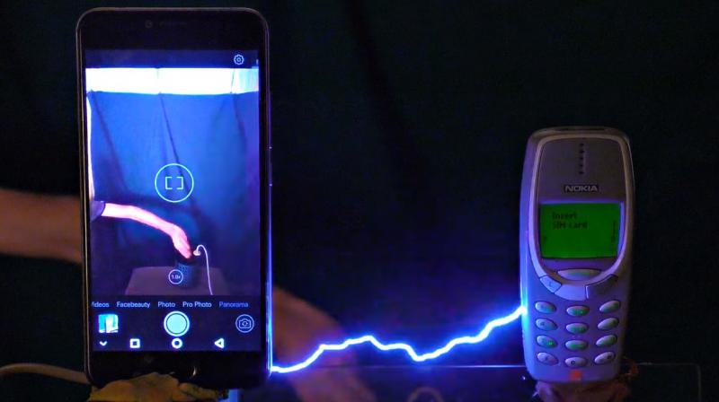 Kreosan had a setup where he could apply 1 million volts of electricity to a mobile phone.
