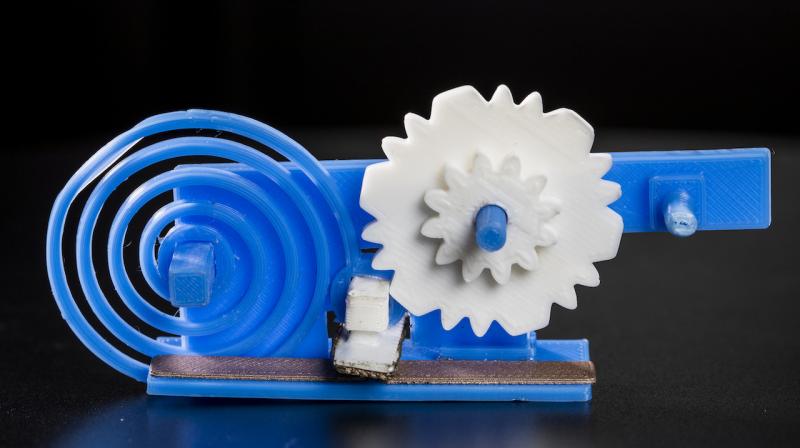 The team developed an anemometer that measures wind speed, and attached it to a gear. When the gear spins, the teeth connect with an antenna incorporated within the object and the antenna then reflects ambient Wi-Fi signal, which is then decoded by a Wi-Fi receiver. (Image: Mark Stone/University of Washington)