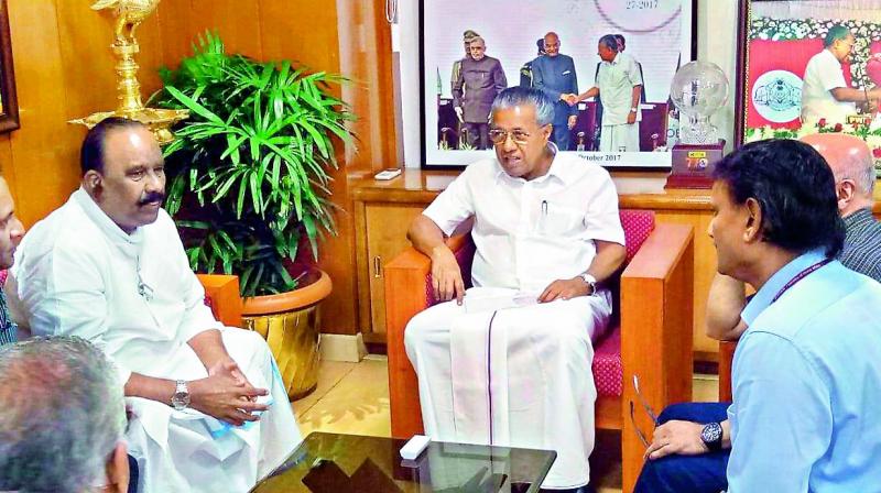 Telangana home minister Nayani Narsimha Reddy discusses the flood situation with Kerala Chief Minister Pinarayi Vijayan in Thiruvananthapuram on Sunday. Mr Reddy handed over a cheque for 25 crore as Telanganas contribution to the relief and rehabilitation of the people affected by the natural calamity in the southern state.