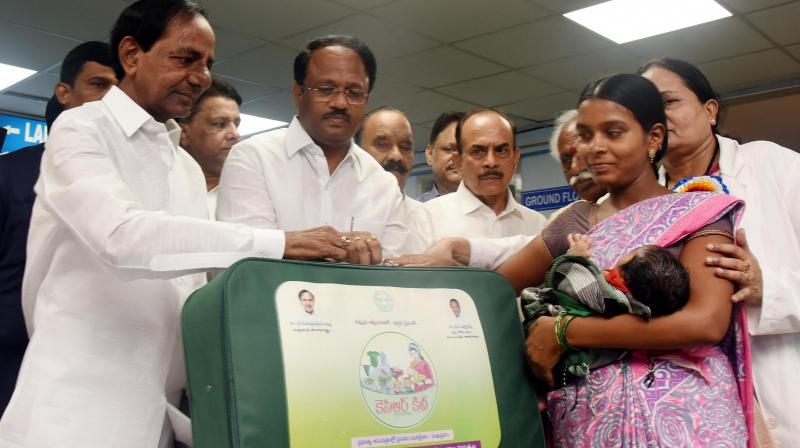 Chief Minister K. Chandrashekhar Rao distributes the KCR Kits to a new mother at the Modern Government Maternity Hospital, Petlaburj in Hyderabad on Saturday. Also seen are Health and Medical Minister C. Laxma Reddy and Telangana deputy chief minister Mohammad Mahmood Ali.