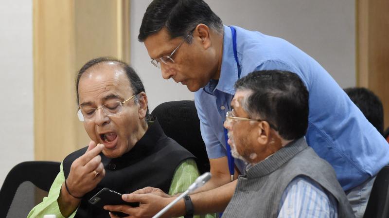 Union Finance Minister Arun Jaitley with MoS Santosh Gangwar and Chief Economic Adviser Arvind Subramanian at the 15th Goods and Services Tax (GST) meeting in New Delhi. (Photo: PTI)