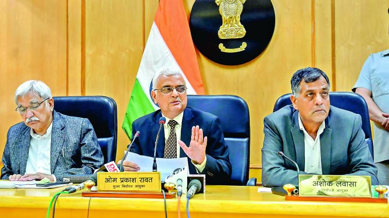 Chief election commissioner O.P. Rawat flanked by election commissioners Sunil Arora (L) and Ashok Lavasa (R) address a press conference to announce the dates for elections in five states, in Delhi, Saturday. (Photo: AP)