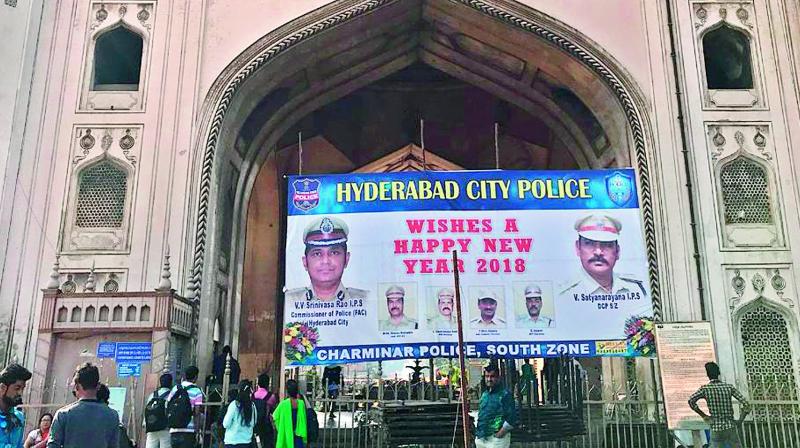 A flexi of Hyderabad police commissioner V.V. Srinivas Rao and South zone DCP V. Satyanarayana was erected in front of Charminar.