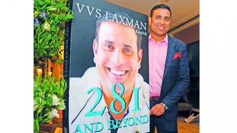 Former Indian cricketer VVS Laxman poses with his book cover at an event in Hyderabad on Friday. 	 Deepak Deshpande