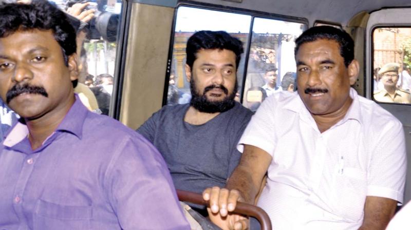 Film producer S. Madhan being taken away for  custodial interrogation from Saidapet court complex on Wednesday. (Photo: DC)