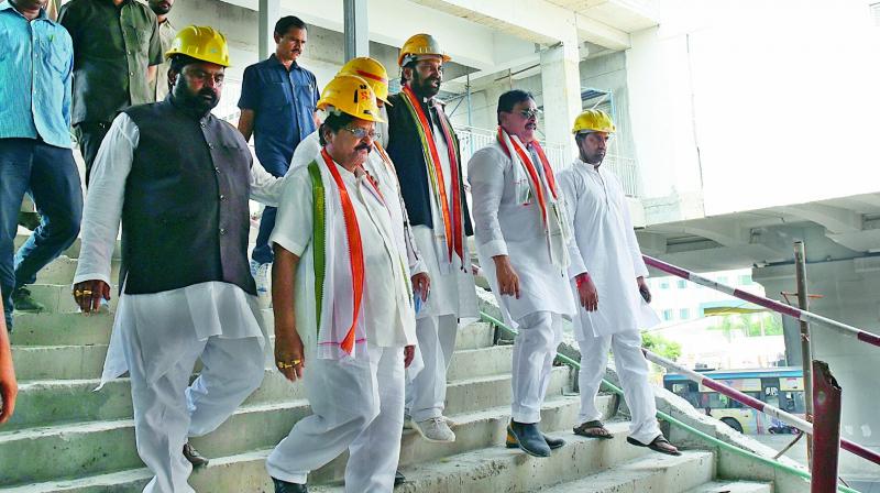 Congress leaders headed by TPCC president Uttam Kumar Reddy visit a Metro Rail station in Hyderabad on Wednesday. 	(Photo: DC)