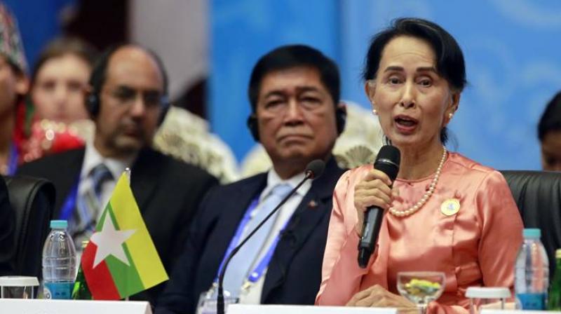 Myanmar Foreign Minister Aung San Suu Kyi, right, speaks during the Asia Europe Foreign Ministers (ASEM) meeting at Myanmar International Convention Centre Monday, Nov. 20, 2017, in Naypyitaw, Myanmar. (Photo: AP)