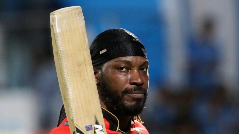 Chris Gayle, who returned to form with a smashing 77 against Gujarat Lions to guide Royal Challengers Bangalore to 21-run win, also became the first cricketer to score 10,000 runs in Twenty20 cricket. (Photo: PTI)