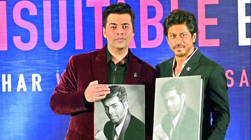 In writing: Karan Johar and Shah Rukh Khan launching the book. (Photos: Viral Bhayani)