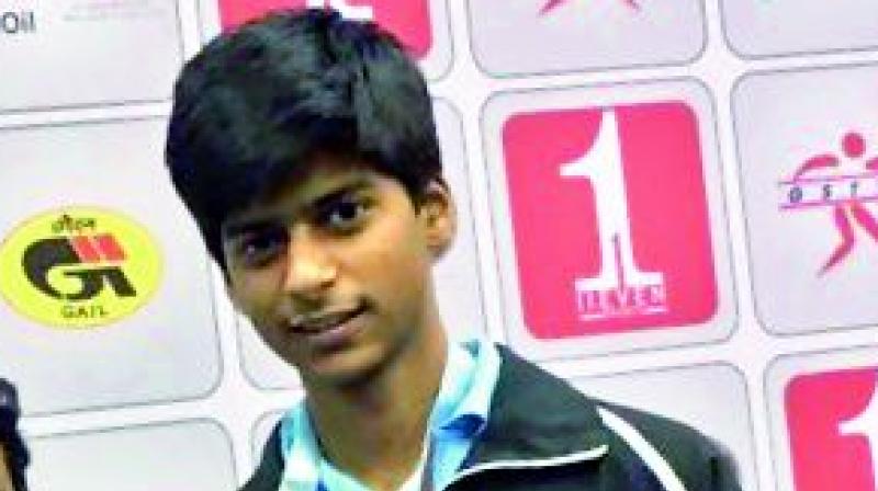 S.F.R. Snehit poses after winning bronze medal in the National table tennis Championship.