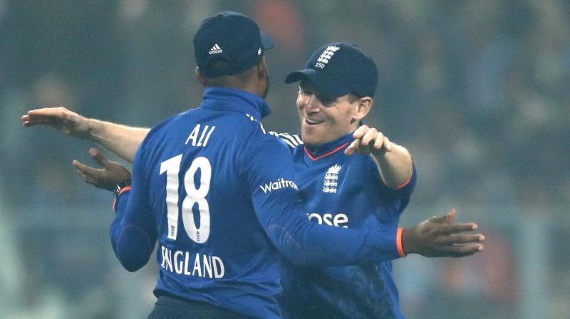 England captain Eoin Morgan hugs Adil Rasheed after wining the third ODI against India at Eden Gardens in Kolkata. (Photo: AP)