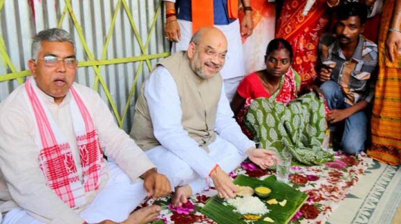 Days after sharing lunch with the Bharatiya Janata Party (BJP) chief Amit Shah at their house, a tribal couple joined Mamata Banerjees Trinamool Congress. (Photo: Twitter/@biswajitroy2009)