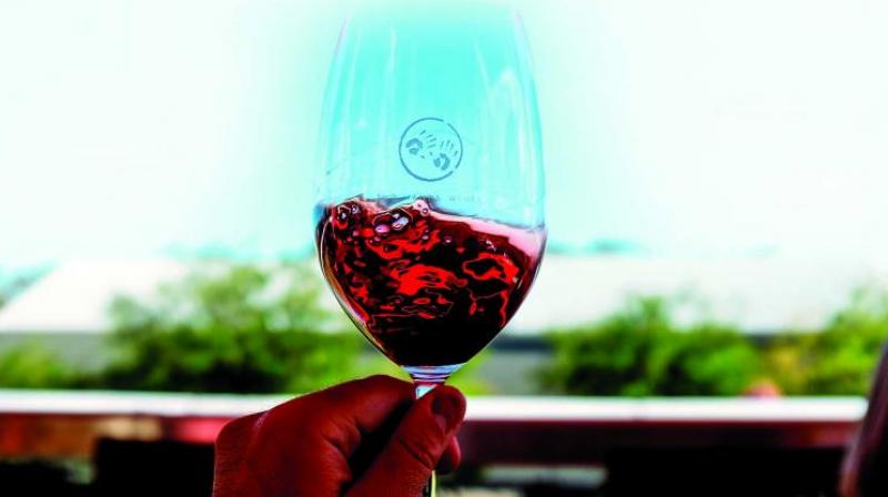 An expensive glass of wine, or your favourite Old Monk. Enjoy them both, says Ajit