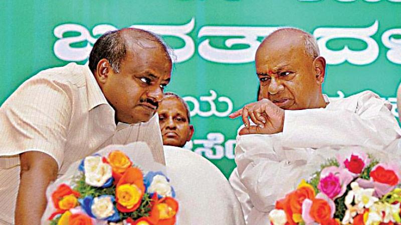A file photo of Janata Dal (Secular) supremo H.D. Deve Gowda with partys state unit president H.D. Kumaraswamy