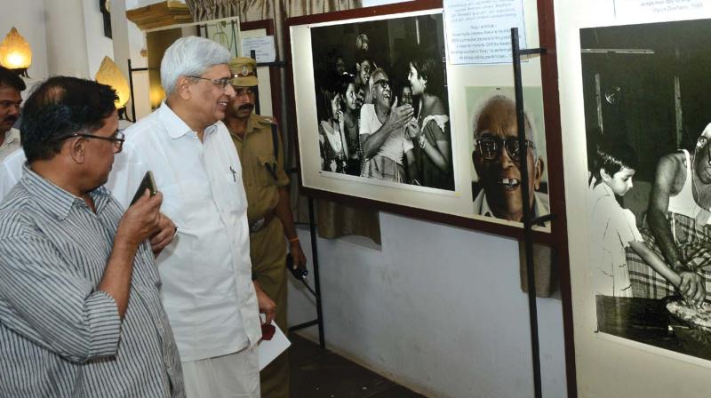 CPM CC member Prakash Karat watches an exhibition on EMS at Kerala Media Academy in Thiruvananthapuram on Friday. (Photo: DC)