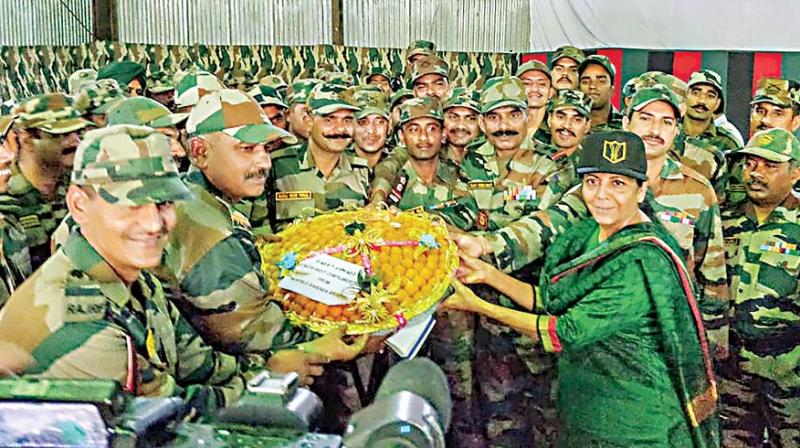 Defence Minister Nirmala Sitharaman celebrating Diwali with soldiers, their families at Hyulong in Arunachal Pradesh on Wednesday. (PTI)