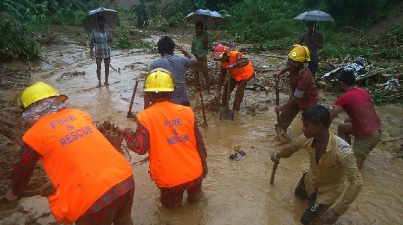 Bangladeshi fire fighters and residents search for bodies after a landslide in Bandarban Bangladeshi fire fighters and residents search for bodies after a landslide in Bandarban (Photo: AFP)