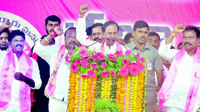 Caretaker Chief Minister and TRS president K. Chandrasekhar Rao addresses an election campaign meet in Karimnagar on Monday. Also seen is Assembly candidate Gangula Kamalakar.