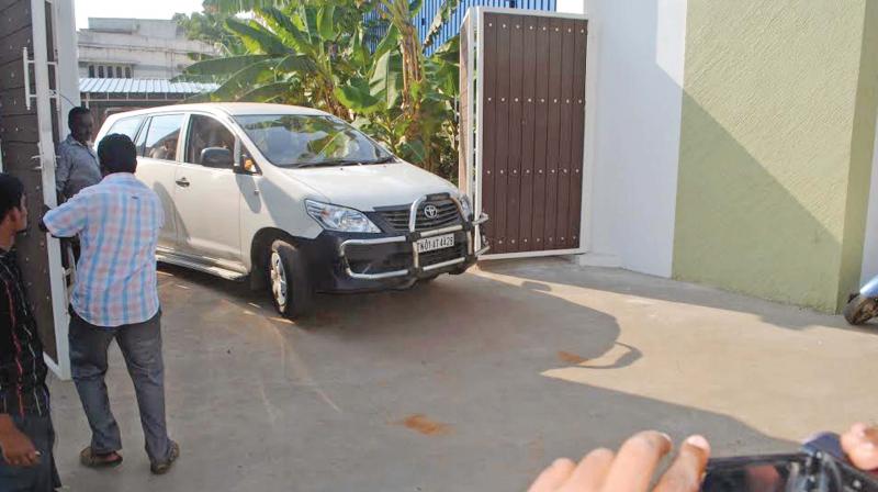 Income tax officials arrive to conduct a raid on the house and office of  Rathinam at Dindigul on Saturday (Photo: DC)