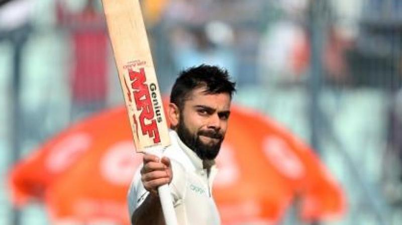Virat Kohli got to his 18th Test hundred with a flat and powerful six over extra cover off paceman Suranga Lakmal and let out a big roar, going down on his knees to celebrate the moment much like former England batsman Kevin Pietersen.(Photo: BCCI)