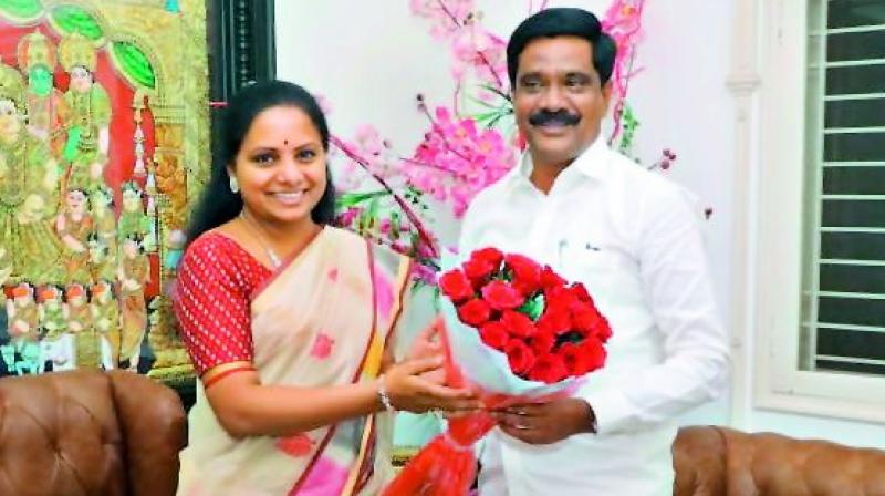 MP Kavitha congratulates minister Prashanth Reddy in Hyderabad on Tuesday. 	 DC