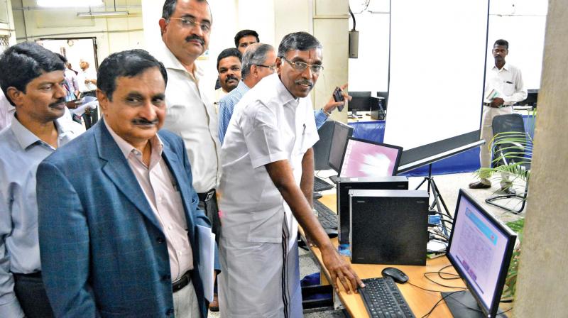 Higher education minister K.P. Anbalagan inaugurating the process to allocate random numbers to engineering applicants on Tuesday here. Higher education secretary Sunil Paliwal and Anna University Vice-Chancellor  M.K. Surappa also seen (Photo: DC)