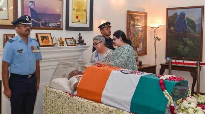 Namita Kaul Bhattacharya, adopted daughter, and Niharika Bhattacharya, grand daughter, pay tribute to former prime minister Atal Bihari Vajpayee, at his Krishna Menon Marg residence, in New Delhi. (Photo: PTI)