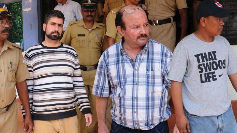 Coastal police produces Captian- Georgianakis Ioannis,30, of Greece (center) Second Mate officer-Galanos Athanasios, 33, Greece (left)and Able Sea Man-Zewana, 36, (Myanmar) before the Thopumpady court in Kochi on Saturday. (Photo: ARUN CHANDRABOSE)