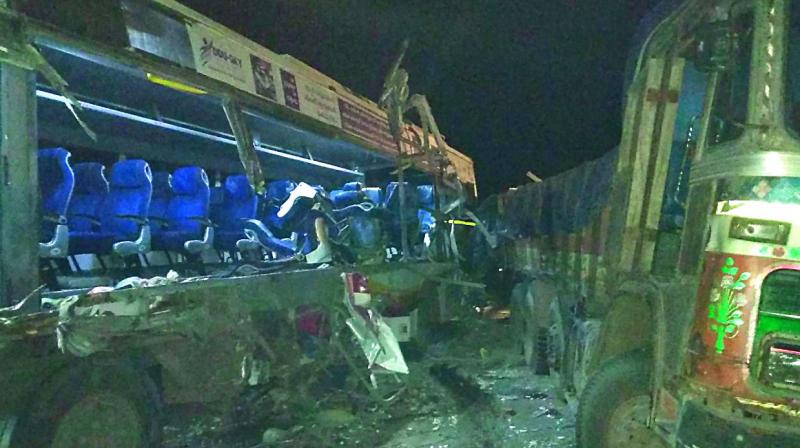 Remains of the APSRTC bus that collided with a truck on the Hyderabad-Vijayawada highway on Sunday.