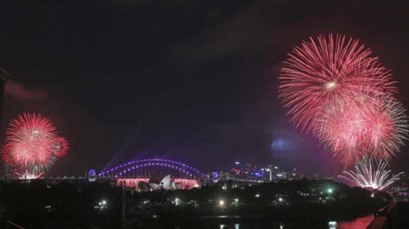 Fireworks explode around the Sydney Opera House and Harbour Bridge as New Years celebrations get underway in Sydney. (Photo: AP)