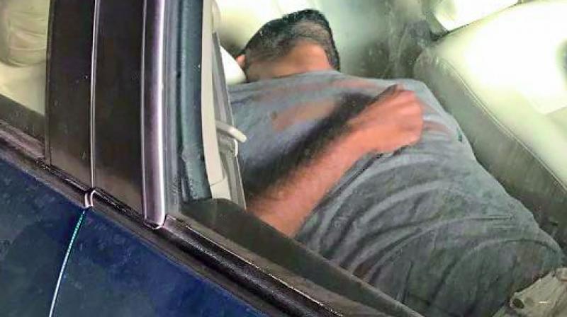 The body of Prabhakar Reddy in the car.