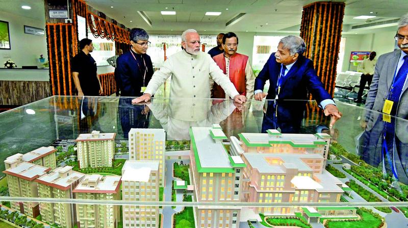 Prime Minister Narendra Modi being explained about the first ever All India Institute of Ayurveda after it was dedicated to the nation, in New Delhi on Tuesday. (Photo: PTI)