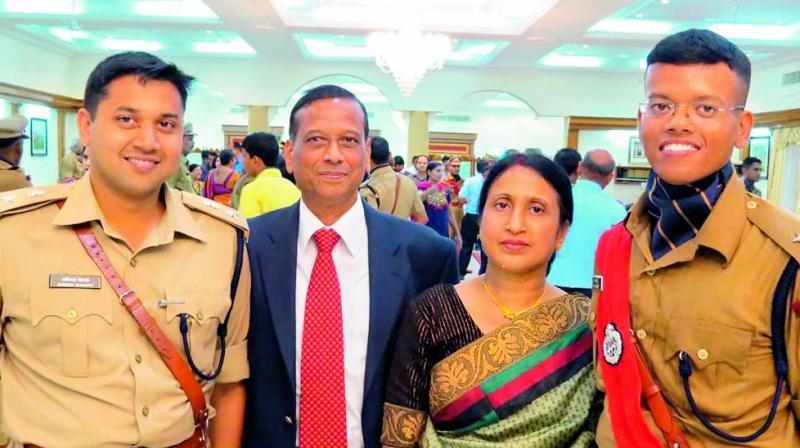 Adviser to Governor Ajit Kumar Mohanty, retired IPS officer, along with his sons Avinash and Abishek Mohanty and his wife Rajashree.