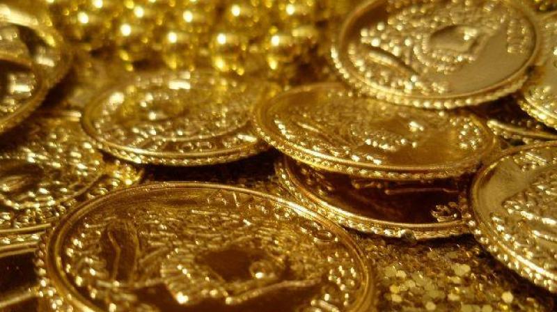 Globally, gold rose 0.39 per cent to USD 1,290.80 an ounce. (Photo: PTI)