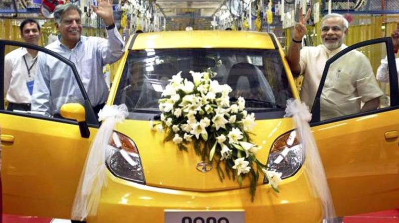 In this file photo, Tata Group chairman Ratan Tata and Gujarat chief minster Narendra Modi launching Nanto car. (Photo: File/AP)