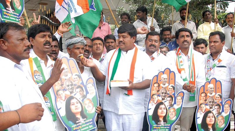 Congress workers  celebrate the victory of Congress candidate Sowmya Reddy in Jayanagar assembly constituency on Wednesday. (Photo:KPN)
