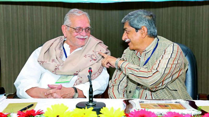 Poet and filmmaker Gulzar interacts with Manuu Vice-Chancellor Dr Mohammad Aslam Parvaiz during a seminar organised by the Urdu Department at the university on Thursday. (Photo: DC)