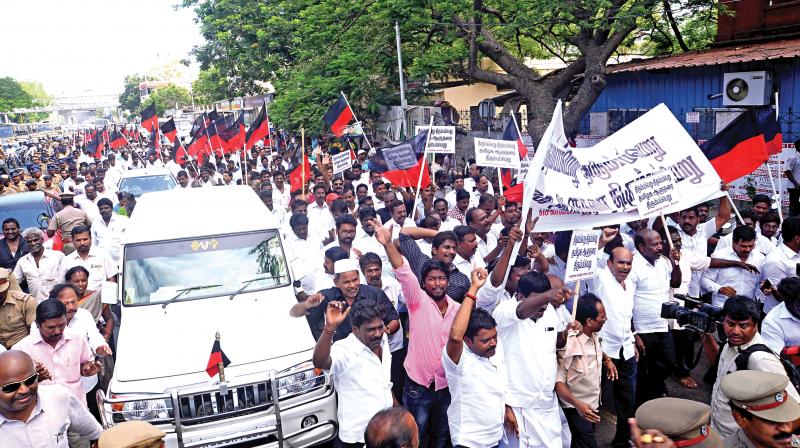 Opposition DMK members march towards Raj Bhavan raising slogans demanding recall of Governor Banwarilal Purohit. Former Mayor Ma.Subramanian led the march. (Photo:DC)