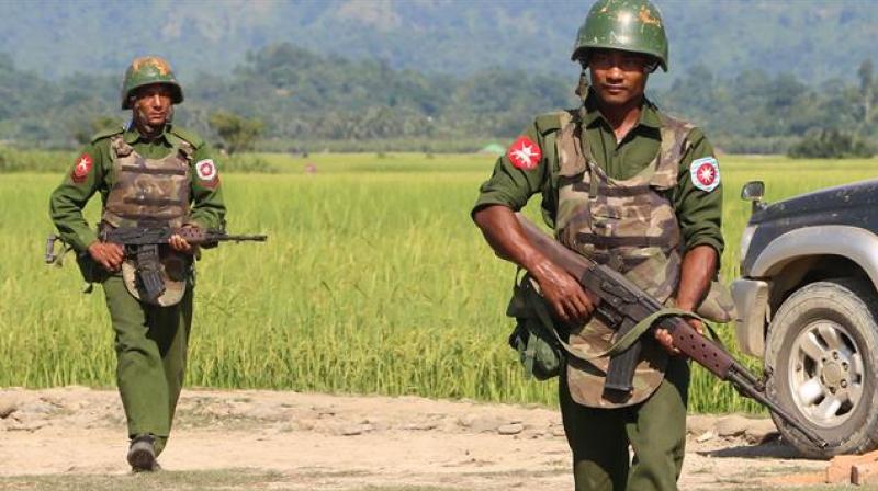 Myanmar troops patrol a village in Rakhine State. (Photo: AFP)